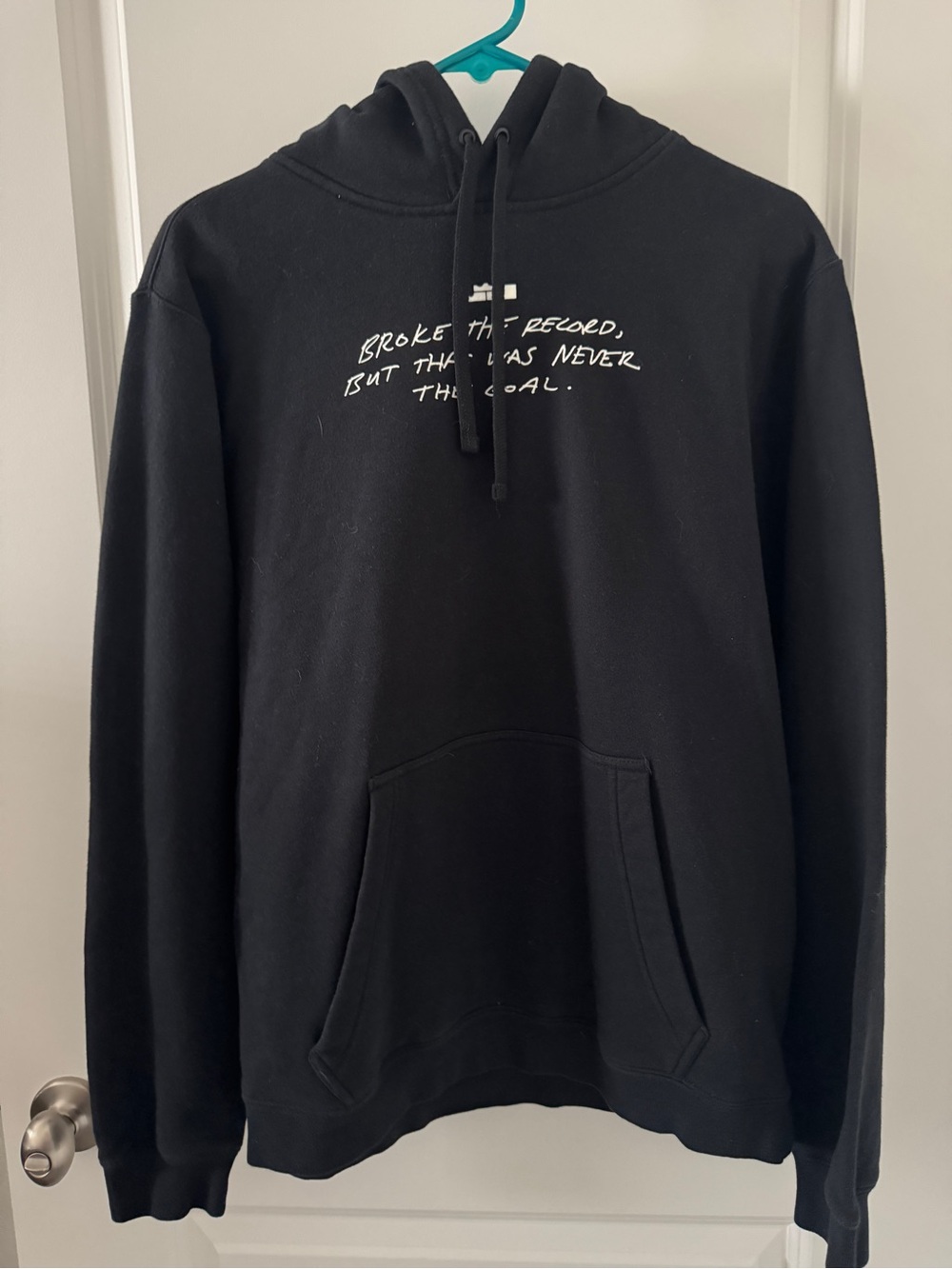 Black Pullover Hoodie with White Script Graphic